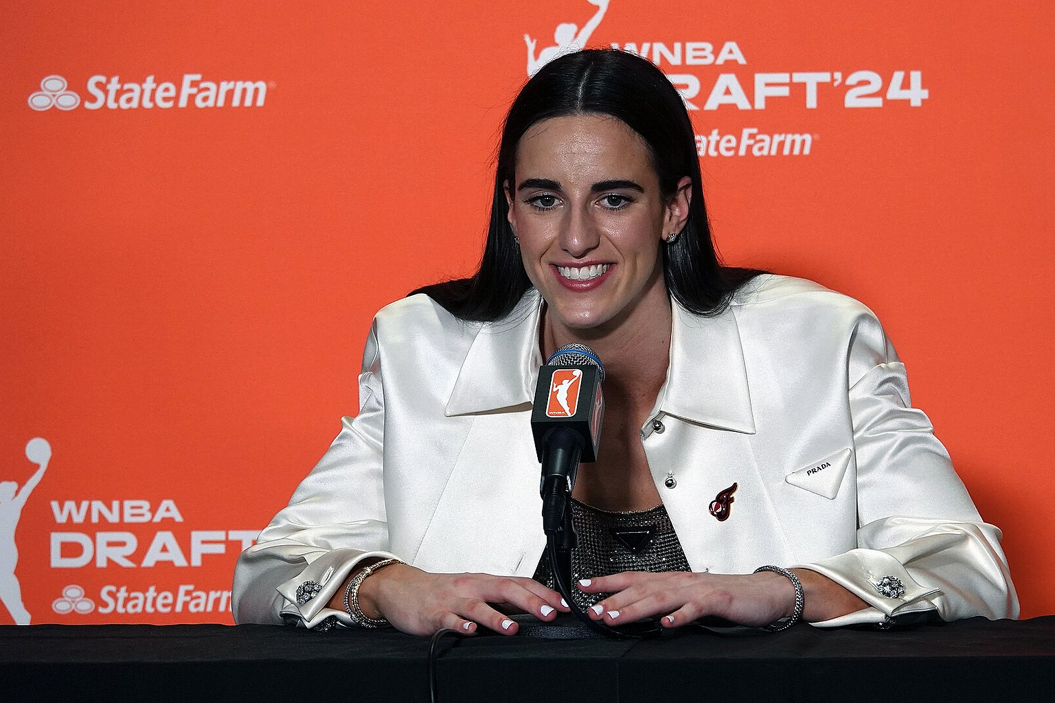 Caitlin Clark answers questions at her press conference moments after being selected first in the 2024 WNBA Draft.