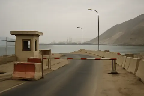Grounded editorial scene illustrating US Secretary of State Marco Rubio highlights dangers of Iranian control over the Strait of Hormuz amid ongoing conflict and casualties.