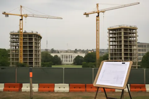 Grounded editorial scene illustrating President Donald Trump will unveil an expanded pledge to protect U.S. households from rising electricity costs linked to data center growth driven by artificial intelligence demand.
