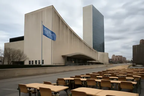 Grounded editorial scene illustrating With Antonio Guterres concluding his second term on December 31, 2026, six candidates vie to lead the UN amid calls for reform and financial challenges.