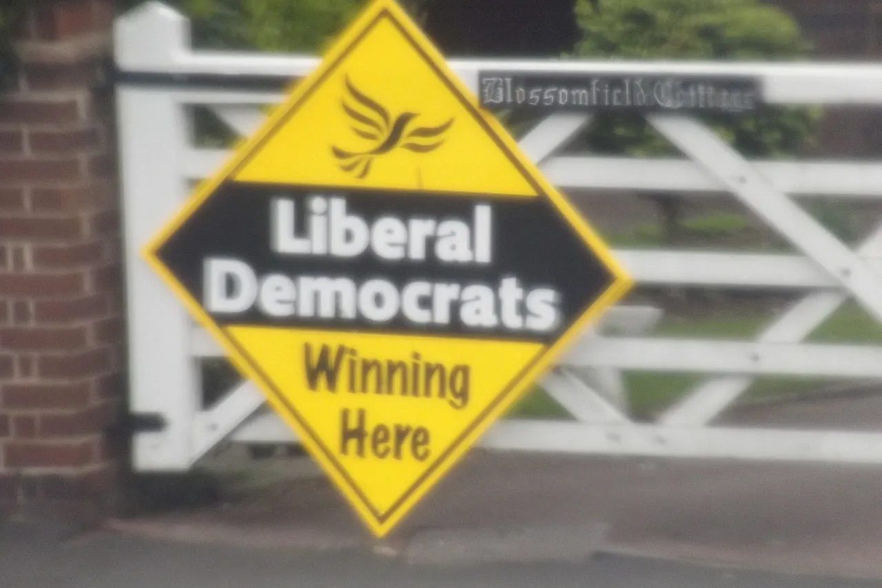 Liberal Democrats NOT Winning Here. Seen in Shirley. In the recent election the Lib Dem's lost Solihull back to the Conservatives after 10 years. Conservatives hold the council there. Longmore Road. Blossomfield Cottages Taken from the top deck of the no 76 bus. Bit blurry, prob due to the window on the bus.