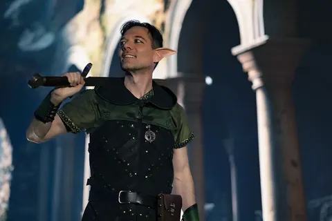 Elf wearing leather armor carrying a sword in an ancient ruin. Model: Stephen Weese