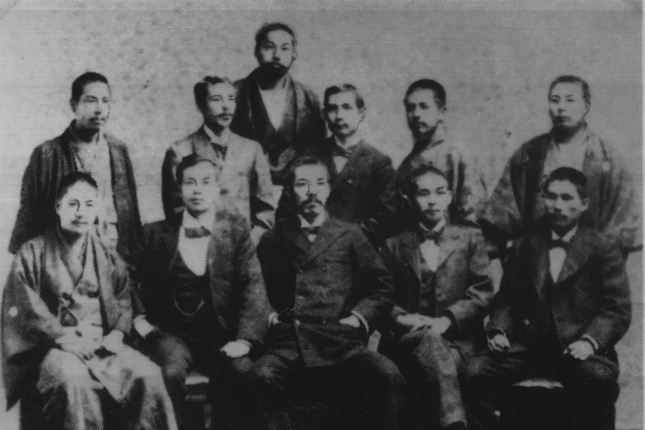 Dr. Sun together with his friends in Japan, 1898 (front row from left) Tasunaga Tonosuke, Yang Quyun, Hirayama Shu, Suenaga Takashi, Uchida Ryohei; (back row from left) Kani Choichi, Koyama Yutaro, Miyazaki Torazo, Sun Yat-sen, Kiyofugi Koshichiro, Ohara Yoshitaka. Sun Yat Sen is the father of China and died at 1925, therefore the photo must be in public domain.