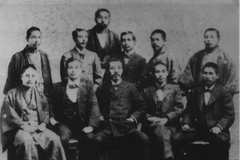 Dr. Sun together with his friends in Japan, 1898 (front row from left) Tasunaga Tonosuke, Yang Quyun, Hirayama Shu, Suenaga Takashi, Uchida Ryohei; (back row from left) Kani Choichi, Koyama Yutaro, Miyazaki Torazo, Sun Yat-sen, Kiyofugi Koshichiro, Ohara Yoshitaka. Sun Yat Sen is the father of China and died at 1925, therefore the photo must be in public domain.