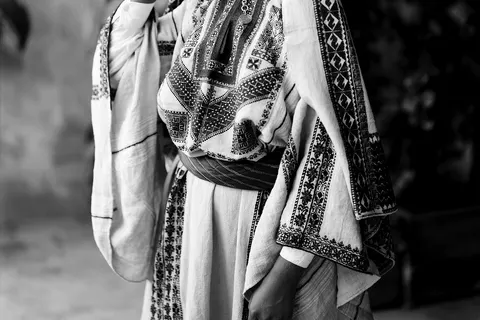 Costumes and characters, etc. Girls of Ramallah. Medium: 1 negative : glass, dry plate ; 10 × 12 in. Fahra Izhak Eadeh on her wedding day, Ramallah. (Source: Mia Grondahl, The Dream of Jerusalem, p. 134.) Young woman of Ramellah wearing dowry headdress.