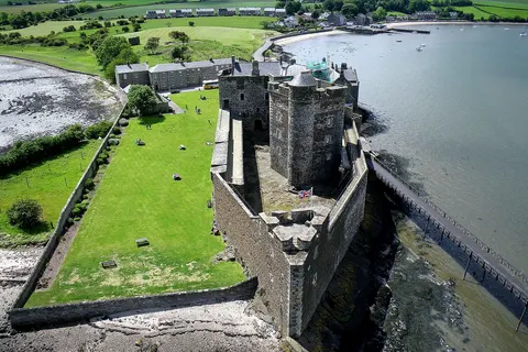 Kite aerial photo of Blackness Castle, Blackness, Scotland. The castle was built in the 1440s on a promontory projecting north into the Firth of Forth.