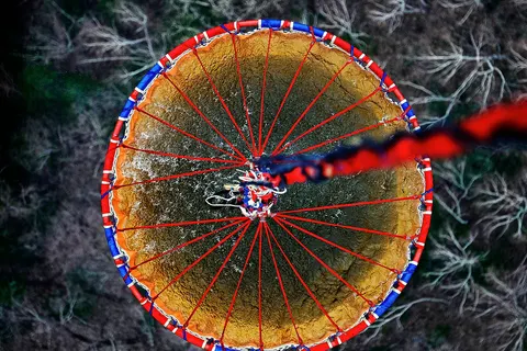 Water for use in aerial firefighting being carried in a bucket attached to a MChS Mil Mi-26 heavylift helicopter in the Vladivostok region.