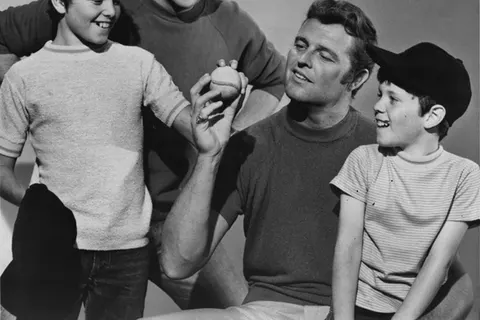 Publicity photo of American actors, (L–R) Christopher Knight , Robert Reed , Don Drysdale and Mike Lookinland promoting their roles on the September 3, 1971 episode of the ABC comedy series The Brady Bunch entitled "The Dropout".