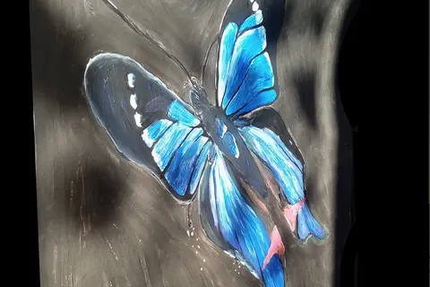 Painting by myself of a blue butterfly flying from chains inspired by Virginia Giuffre's organisation "Victims Refuse Silence"