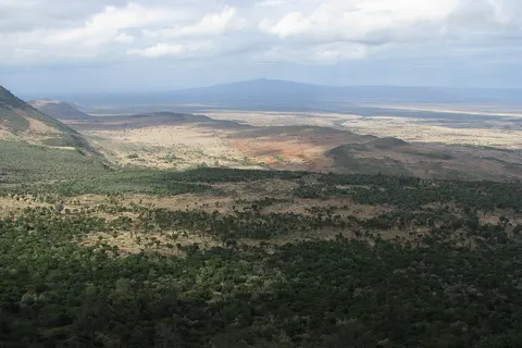 A view of the Great Rift Valley in Kenya. The Great Rift Valley is a name given in the late 19th century by British explorer John Walter Gregory to the continuous geographic trench, approximately 6,000 kilometres (3,700 mi) in length, that runs from northern Syria in Southwest Asia to central Mozambique in East Africa. (Oct/ Nov 2010)