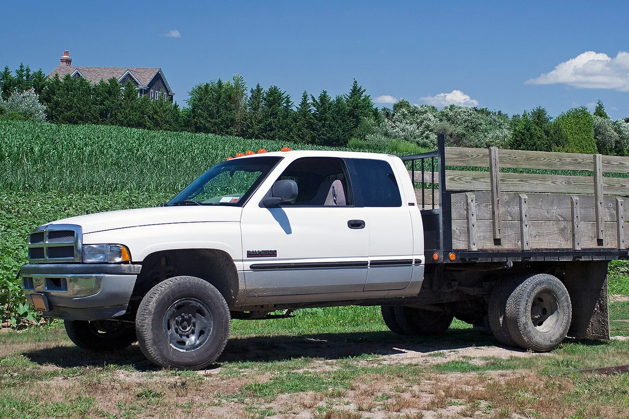 1999 Dodge Ram Cab 2500 Chassis Club Cab 4x4, 5.9 litre Cummins inline-six 24V turbodiesel. Built at Dodge's St. Louis North plant, this agricultural truck has a GVWR of 8,800 lbs. A stake bed truck follows the design of a standard flat bed, but with sockets along the edge that allow upright stakes to be fixed. When the stakes are fixed, they form a fence around the cargo area.
