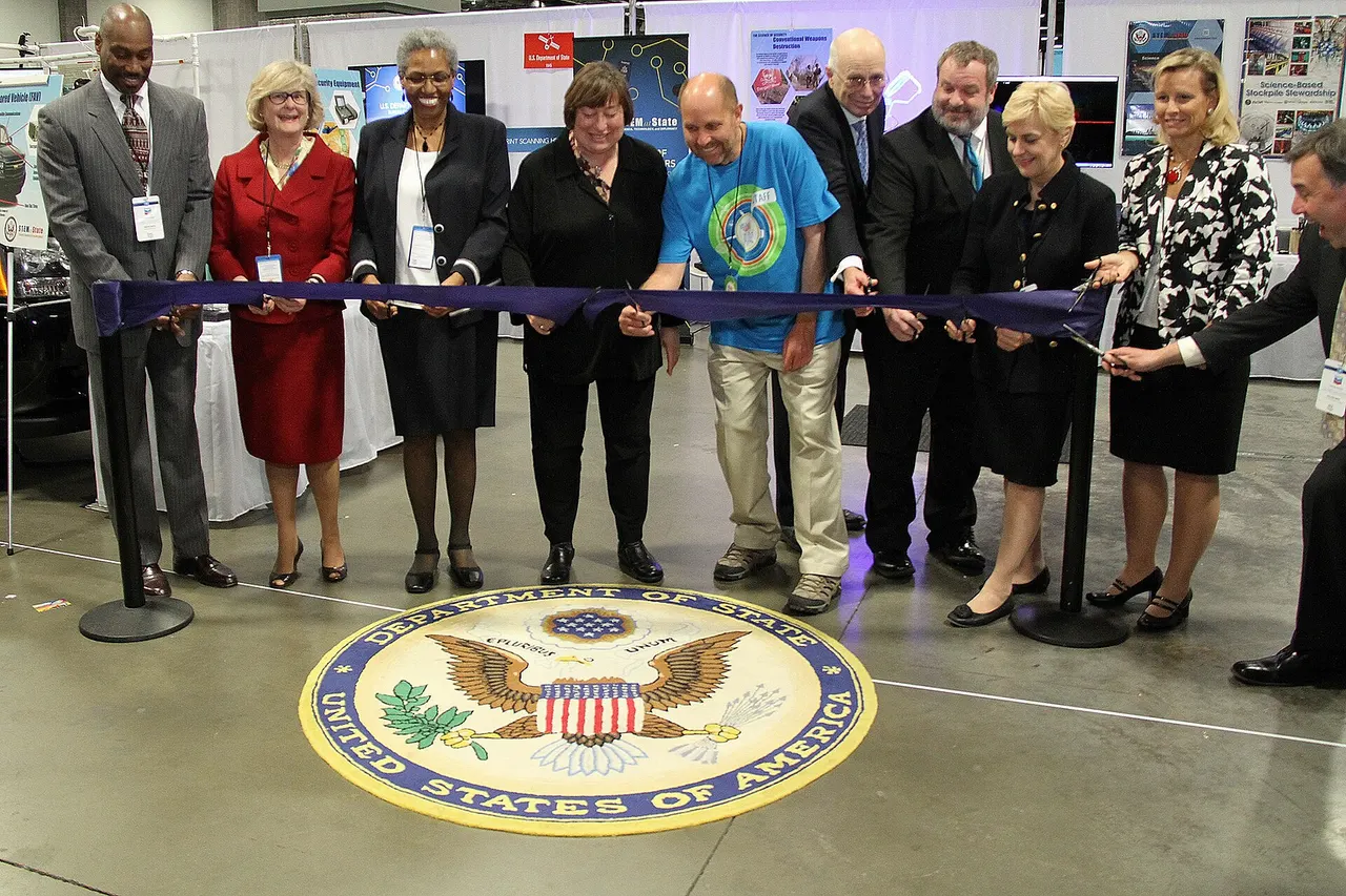 State Department VIPs cut the ribbon officially opening the State Department exhibit at the Department of State booth at the USA Science and Engineering Festival in Washington, DC on April 25, 2014. [State Department photo/ Public Domain]