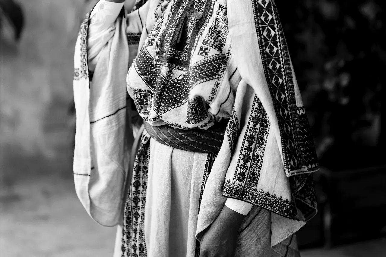 Costumes and characters, etc. Girls of Ramallah. Medium: 1 negative : glass, dry plate ; 10 × 12 in. Fahra Izhak Eadeh on her wedding day, Ramallah. (Source: Mia Grondahl, The Dream of Jerusalem, p. 134.) Young woman of Ramellah wearing dowry headdress.