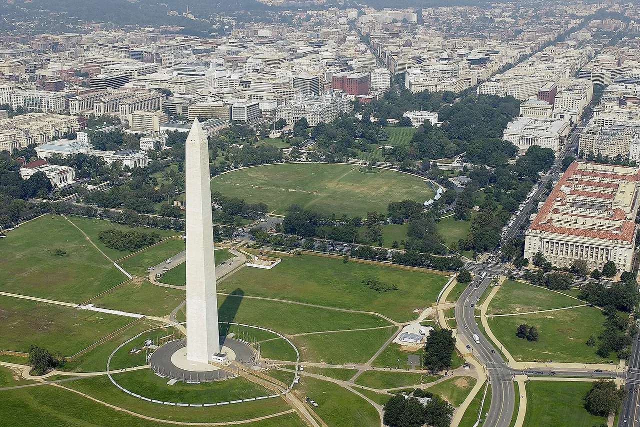 Washington, D.C. (Sept. 26, 2003) - Aerial view of the Washington Monument with the White House in the background.