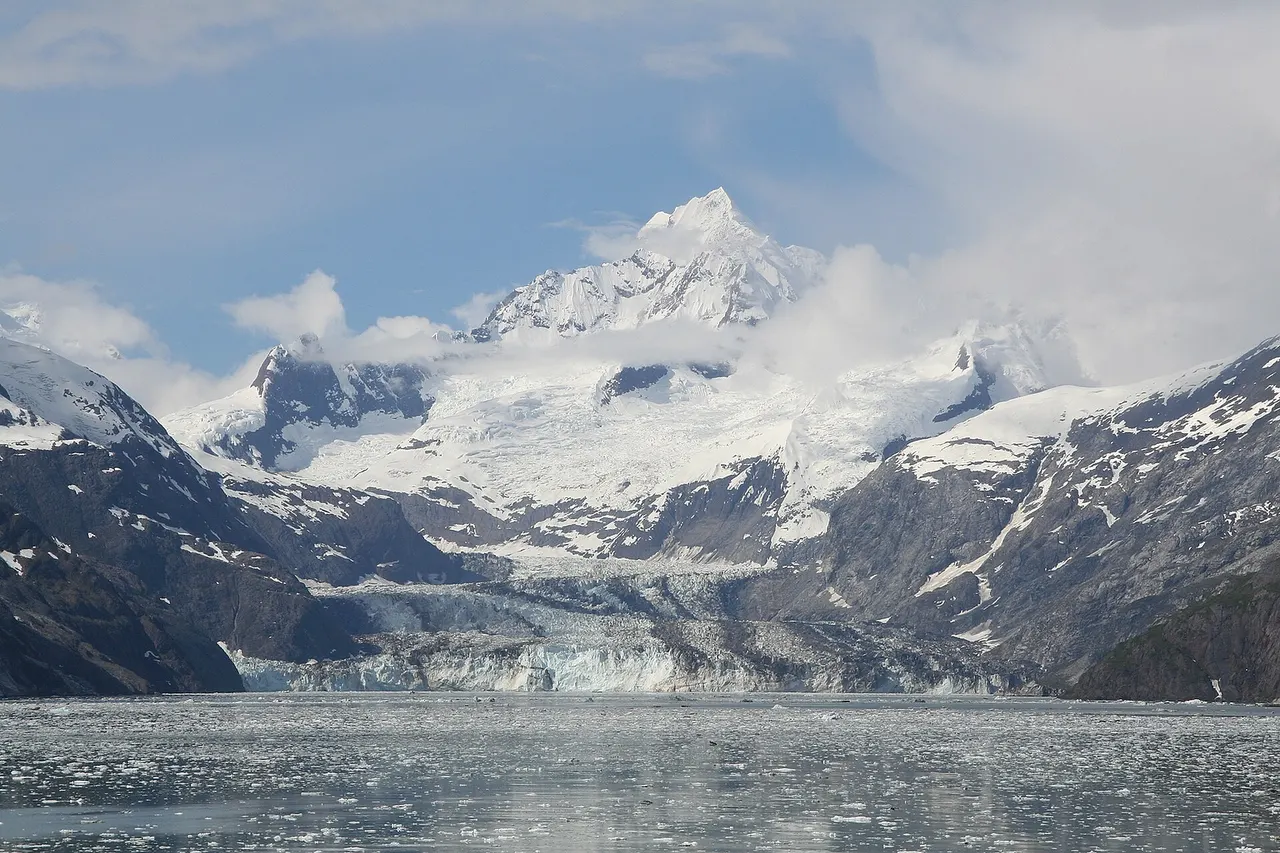 John Hopkins Glacier with Mount Orville and Mount Wilbur behind it, as seen from Glacier Bay in 2014.