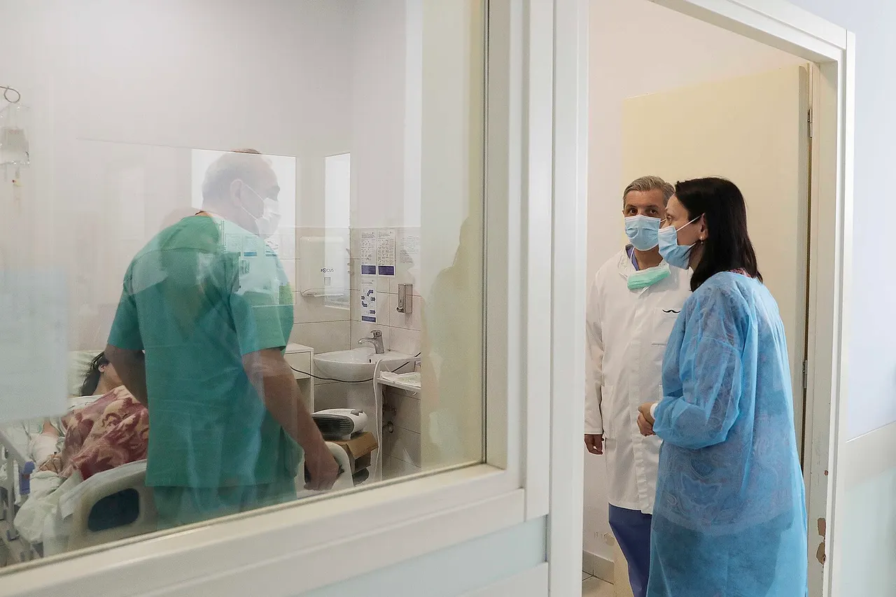 Natia Sulava, head of the Administration of President Salome Zourabichvili of Georgia, visiting a burn patient, victim of a case of domestic violence.