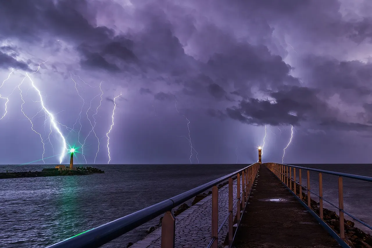 Lightning during an overnight storm at the port and lighthouse in Port-la-Nouvelle in the Aude department in southern France .