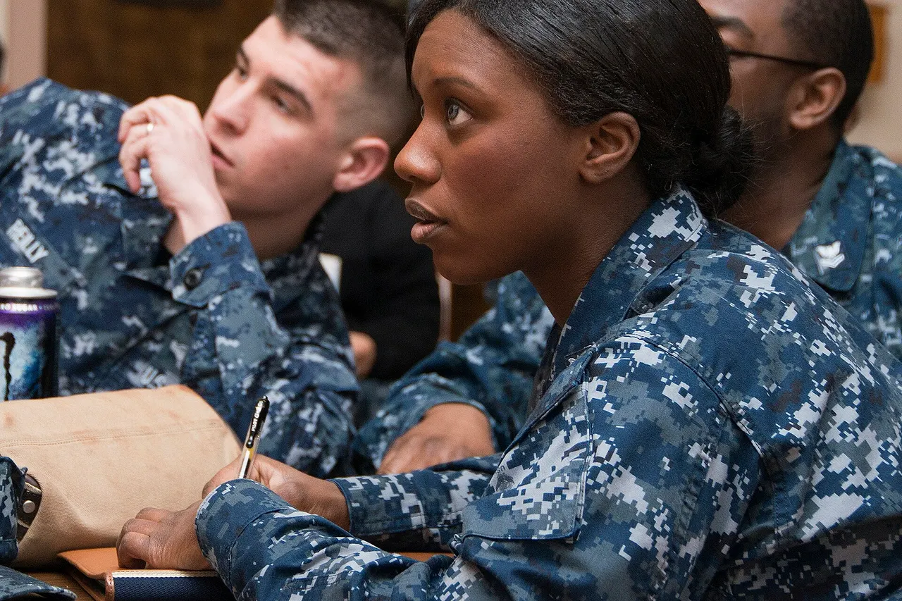 Hospital Corpsman 2nd Class Maya L. Dover and her team carefully consider the answer options to a final round question during an African-American Quiz Bowl during a Black History Month celebration at the Captain James A. Lovell Federal Health Care Center. Teams answered trivia questions based on black history, pop culture and black history within the U.S. Navy. (U.S. Navy photo by Mass Communication Specialist 2nd Class Darren M. Moore/Released)