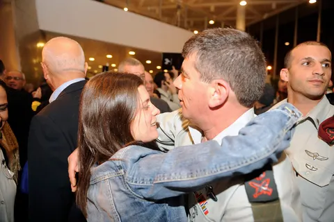 This evening, a farewell ceremony in Tel Aviv was held in honor of Lt. Gen. Gabi Ashkenazi who finishes his four year term as the 19th IDF Chief of Staff. The ceremony was attended by the families of fallen IDF soldiers and officers, as well as senior IDF and governmental officials including President Shimon Peres, and friends and family of Lt. Gen. Ashkenazi. Pictured above: Lt. Gen. Ashkenazi gives a hug to Karnit Goldwasser, widow of Udi Goldwasser, of blessed memory.