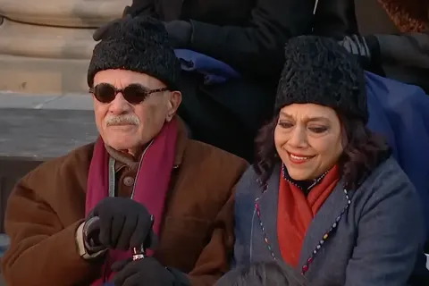 Mira Nair and Mahmood Mamdani in the crowd of their son Zohran Mamdani's inauguration.