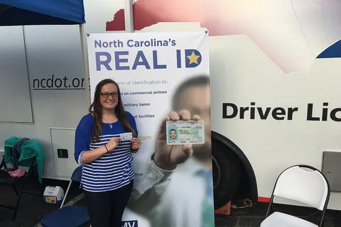 The NCDMV Gets Real at the 150th N.C. State Fair The NC Division of Motor Vehicles informed fairgoers about N.C. REAL ID and issued more than 420 driver licenses, learner’s permits, identification cards and REAL IDs at the 2017 North Carolina State Fair. In their usual location between the Dorton Arena and Jim Graham Building, the DMV Mobile RV, housing a two-person mobile driver license office, was available Monday through Saturday for duplicate and renewal services. More than 50 DMV educated the public on N.C. REAL ID, the new, single form of identification for flying and visiting federal facilities, military bases and nuclear power plants. The staff answered questions about driver licenses, ID cards, vehicle registrations and titles, vehicle theft and identity fraud, as well as services that can be handled online without visiting a driver license office or license plate agency. Commissioner Torre Jessup joined the team on opening day to educate the public on REAL ID. For more information on REAL ID, visit NCREALID.gov.