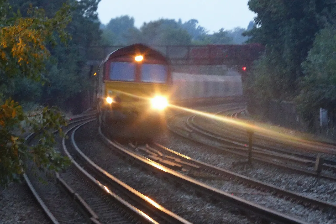 DB Schenker Rail (UK) Ltd's class 66 (JT42CWR) number 66175 working 6O32 hauling loaded (GE Rail Services?) IHA bogie covered steel coil carrier wagons on 23 September 2014 transporting steel from Tata Steel Limited's Port Talbot steelworks to Dollands Moor ultimately destined for Broekman Group in Rotterdam or Myriad in Maubeuge France via Calais Fréthun (for a map of the route taken <a href=" https://www.flickr.com/photos/99279135@N05/14092887923/ ">click here</a>). For just over half the year 6O32 is timetabled to reach here in the twilight or dark so cant be photographed easily but Chalkie got a better photo of it earlier on route at <a href=" https://www.flickr.com/photos/63924222@N06/15145125700/ ">Chipping Sodbury</a> waiting in a loop. From Dollands Moor the wagons continue through the Channel Tunnel to Calais Fréthun hauled by a class 92. From Calais-Fréthun they are thought to continue to Broekman Group in Rotterdam, the Netherlands on Tuesdays, Thursdays and Sundays or to Myriad in Maubeuge France on Mondays, Wednesdays and Fridays. According to Andy.L the wagons being hauled were 8749040428, 8746670003, 8747670036, 8749150037, 8749040113, 8746670441, 8446670747, 8446671448, 8446671703, 8446671026, 8746670060, 8746670698, 8746670391, 8746670086, 8446671174, 8446671166, 8746671084, 8749040071, 8749040287, 8749040337 and 8446671190. Nicolas B photographed class 66 number 052 passing <a href=" https://www.flickr.com/photos/jobiwannn/14454791461/ ">Staple</a> (department 59 France) heading to Maubeuge on 19 June 2014 (including two wagons <a href=" https://www.flickr.com/photos/jobiwannn/14271918247/in/photostream/ ">numbers 37 84 4667 127 and 37 84 4667 184-4</a>), Laurent Knop photographed a similar set of wagons at Landas (department 59 France) hauled by two locomotives including class 77 number 008 (previously HLD 5709) also working from (<a href=" https://www.flickr.com/photos/x4644/13983513315/in/faves-99279135@N05/ ">Calais Fréthun to Maubeuge</a>) on 17 April 2014 and another similar set of wagons was photographed by Tarek Marouane at La Chapell D'Armentieres France returning to the UK from Maubeuge being hauled by class 66 number 062 on 5 April 2014 (photo and account now removed from Flickr). The service from Calais Fréthun to Rotterdam was photographed by Laurent Knop at (<a href=" https://www.flickr.com/photos/x4644/13376721024/in/photolist-mo4c87-6TKfHN-mRuxU6-efEd4W-eUPAWR-niFaka-f7Ebnf-cXCV2s-e6hGdj-e6c3Ng-e6c3Mn-e6c3NM-7p7y2n-5RJ8oH-eemxF6-5SUyMK-9wfo6t-9wfp7r-efEnRb-eHWMoe-db1s5G-k432Uv-daUQHj-8RqgW5-6TFecK-fBc53p-nnfY9h-njNTt9-d9g7W5-npPZMM-no4p3H-8a19qx-dpmTB4-5H3TjQ-nrjkBX-njNZUf-nmz2yt-nmRva2-nr5dxn-npiuzR-e5UdcY-nfvdEL-ahJaQZ-9wfmvn-ciQA9A-fKAcPm-8RnaDD-8RnaHr-8RqgY3-8RnaBM ">Merris</a>) (department 59 France) going via Mouscron Belgium. 66175 (works number 968702-175) was built by General Motors Electro-Motive Division, London, Ontario, Canada in 1999 and unloaded from the Heavy Lift Ship MV "Jumbo Challenger" at Newport Docks on 19 November 1999. The steel flow from South Wales to Maubeuge (France) and to Broekman (Holland) stopped running through the Channel tunnel at the end of November 2015. The flow to Maubeuge was cancelled as the cold mill which produced this material was mothballed as part of the Tata Steel strip downsizing programme. Instead Maubeuge is supplied from Tata Steels Limuiden plant (Holland). 2 grades of steel were also supplied by Tata Steel to Broekman Group to make oil drums. With one grade being sourced from elsewhere the remaining 700 tonnes per week of the second grade was not sufficient to run a block train. Despite Slough Railway Station being reported as having been closed for the day due to the sad deaths of a mother and her son Realtime Trains showed the route and timing of 6O32 remained unaffected; Margam Terminal Complex.....1000..................1007..............................7L Margam Moors Junction..........1005..................1011 1/4..........................6L Stormy...........................................1014...................1022 1/2........................8L Bridgend [BGN] 2.......................1020..................1026 3/4.......................6L Pontyclun [PYC]..........................1033..................1037..............................4L Cardiff Central [CDF] UML.......1057..................1101................................4L Marshfield....................................1108...................1112................................4L Ebbw Junction............................1113.....................1116................................3L Newport [NWP] URL..................1116....................1119 1/2..........................3L Maindee West Junction...........1118....................1120 3/4........................2L Llanwern West Junction...........1122...................1125 1/2.........................3L Llanwern Steelworks East.......1247...................1235 1/4.......................11E Severn Tunnel Junction 4........1300..................1256 1/2........................3E Severn Tunnel West..................1301...................1301...............................RT Severn Tunnel East...................1307...................1306 3/4.......................RT Pilning [PIL] 1................................1310...................1310...............................RT Patchway [PWY] 1.......................1319 1/2.............1318 1/4..........................1E Bristol Parkway [BPW] UPL......1322..................1323 3/4........................1L Westerleigh Junction................1328 1/2............1333 1/2........................5L Chipping Sodbury UDG...........1335 1/2/1342..N/R/1340 3/4................1E Badmington.................................1350..................1347 1/2........................2E Hullavington UGL.......................1400/1416.........N/R/1354...................22E Little Somerford..........................1424 1/2............1400...........................24E Wootton Bassett Junction.......1437...................1406 1/2.....................30E Rushey Platt................................1443 1/2............1415 3/4.....................27E Swindon [SWI] UML...................1445...................1422 3/4....................22E Highworth Junction...................1449/1515.........1426/1449.................25E Uffington (Oxfordshire) U..........1529..................1501............................27E Challow.........................................1532..................1502 1/2.....................29E Wantage Road............................1537/1557.........1506 3/4/1506 3/4..50E Steventon.....................................1603..................1510 1/2......................52E Milton Junction...........................1605..................1512 1/2......................52E Foxhall Junction[XJF]................1607..................1515 3/4......................51E Didcot Parkway [DID] 4............1609/1614.........1608 3/4/1609............4E Didcot East Junction.................1616...................1609 1/4........................6E Moreton Cutting.........................1617 1/2.............1610 3/4........................6E Cholsey [CHO] 4........................1621...................1615 3/4........................5E Goring & Streatley [GOR] 4......1625..................1619 1/4.........................5E Pangbourne [PAN] 2.................1629..................1622 1/4........................6E Tilehurst [TLH] 4.........................1632..................1625 1/4........................6E Tilehurst East Junction.............1632 1/2............1625 1/2........................6E Reading West Junction............1634...................1627 1/2........................6E Reading [RDG] 14.......................1635..................1629 1/2........................5E Kennet Bridge Junction...........1636 1/2............1630 1/2........................5E Twyford [TWY] 4.........................1643 1/2............1636 1/2........................6E Ruscombe....................................1645..................1637 3/4.......................7E Maidenhead West......................1651 1/2.............1642 1/2........................8E Maidenhead [MAI] 4..................1651 1/2.............1643..............................8E Maidenhead East.......................1652..................1643 1/4........................8E Taplow [TAP] 4...........................1654..................1644 3/4.......................9E Burnham [BNM] 2.......................1655 1/2............1646 1/4........................9E Slough West................................1658..................1648............................10E Slough [SLO] 5............................1659..................1648 3/4.....................10E Dolphin Junction........................1701 1/2.............1649 1/2.......................11E Langley [LNY] 4..........................1703 1/2............1651.............................12E Iver [IVR].......................................1706..................1653............................12E Heathrow Airport Junction......1713....................1700 3/4.....................12E Hayes & Harlington [HAY] 4....1713 1/2.............1701 3/4.......................11E Southall West Junction.............1716....................1703 1/2......................12E Southall [STL] 4...........................1718....................1706.............................11E Southall East Junction..............1719 1/2.............1706............................13E Hanwell Bridge Loop LP..........1721/1735..........1706 1/4/1738 3/4.......3L Ealing Broadway [EAL]..............1741....................1743 1/2........................2L Acton West..................................1742 1/2............1746..............................3L Acton Main Line [AML] DG......1749/1751..........1746 1/2/1751 3/4........RT Acton Wells Junction................1757...................1755 3/4........................1E Mitre Bridge Junction...............1811....................1807 3/4.......................3E North Pole Signal Vc818..........1812...................1810................................1E North Pole Junction..................1812 1/2.............1809 1/2........................3E Shepherds Bush [SPB] 1...........1815...................1814 1/4.........................RT Kensington Olympia [KPA] 3...1816...................1816 1/2.........................RT West Brompton [WBP] 3...........1819...................1821 1/4.........................2L Imperial Wharf [IMW] 1..............1820 1/2............1824 1/4........................3L Latchmere Junction..................1823 1/2............1827 3/4.......................4L Factory Junction........................1839/1845........N/R/1839 3/4...............5E Voltaire Road Junction ............1846 1/2............1845 1/4.........................1E Brixton [BRX]...............................1850..................1851................................1L Herne Hill [HNH] 3.....................1852..................1855 3/4.......................3L Kent House [KTH] 3...................1859..................1904 1/2........................5L Beckenham Junction 3............1900 1/2............1905 1/2........................5L Shortlands Junction[XOR].......1902 1/2............1906 3/4.......................4L Shortlands [SRT].........................1903 1/2............1907 3/4.......................4L Bromley South [BMS] 3.............1905 1/2............1908 1/2........................3L Bickley Junction[XLY]...............1910...................1911 3/4..........................1L Petts Wood Junction[XPE].......1913....................1917...............................4L Orpington [ORP] 3.....................1915 1/2.............1921 1/4.........................5L Chelsfield [CLD]..........................1918...................1924..............................6L Sevenoaks [SEV] 3....................1929..................1933 1/4........................4L Tonbridge [TON] DF..................1937...................1940 3/4.......................3L Paddock Wood [PDW] DM.......1943...................1946 3/4.......................3L Headcorn [HCN] DM.................1954..................1958..............................4L Ashford International 6.............2010..................2010 1/4........................RT Dollands Moor Sidings ............2024.................2029.............................5L The timing of the rerouted 6O32 working via Beckenham Junction causes delays to the 18:45 stopping passenger service from London Victoria to Orpington that now follows it. 00London Victoria [VIC] 41845184518441EDF 073Grosvenor Bridge Jn pass1847½No report 145Linford Street Jn pass1848½No report 161Factory Jn pass1849No report 25Voltaire Road Jn. [XVJ] pass1849½pass1849¼RTM 217Clapham High Street [CLP] pass1849½No report 256Shepherds Lane Jn pass1850½No report 310Brixton [BRX] 1851½1852185218521855½1856¾4LH 372Herne Hill [HNH] 31853½1854½185418541858½1859¾5LM 478West Dulwich [WDU] 1856½185718571857No report 553Sydenham Hill [SYH] 1858½185918591859190419056L 711Penge East [PNE] 1901½190219021902No report 762Kent House [KTH] 31903½1904190419041910¼1911¼7L 849Beckenham Junction [BKJ] 31905½1906½19061906191319147L 953Shortlands Jn [XOR] pass1908½pass1916½8LFL 979Shortlands [SRT] 19091909½190919091917½1919¼9LFF 1067Bromley South [BMS] 31911½1912½191219121920¼1921¼8LF 1172Bickley [BKL] 1914½191519151915No report 1234Bickley Jn [XLY] pass1916½pass19269LT 1325Petts Wood Jn [XPE] pass1918pass19279LDS 1354Petts Wood [PET] 1919192019191920No report 1466Orpington [ORP] 6192319251932¾9L As such 6O32 may be rescheduled in a few weeks time.