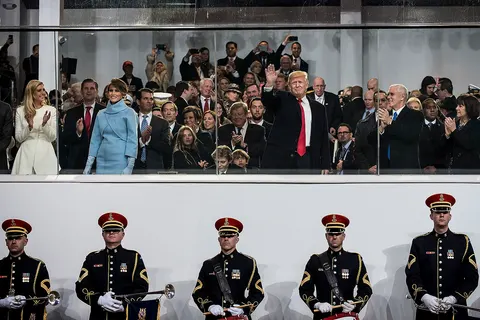 U.S. President Donald Trump greets the crowd from the presidential review stand during the 58th Presidential Inauguration Parade in Washington, D.C., on Jan. 20. The parade route stretched approximately 1.5 miles along Pennsylvania Avenue from the U.S. Capitol to the White House. (U.S. Army Reserve photo by Master Sgt. Michel Sauret)
