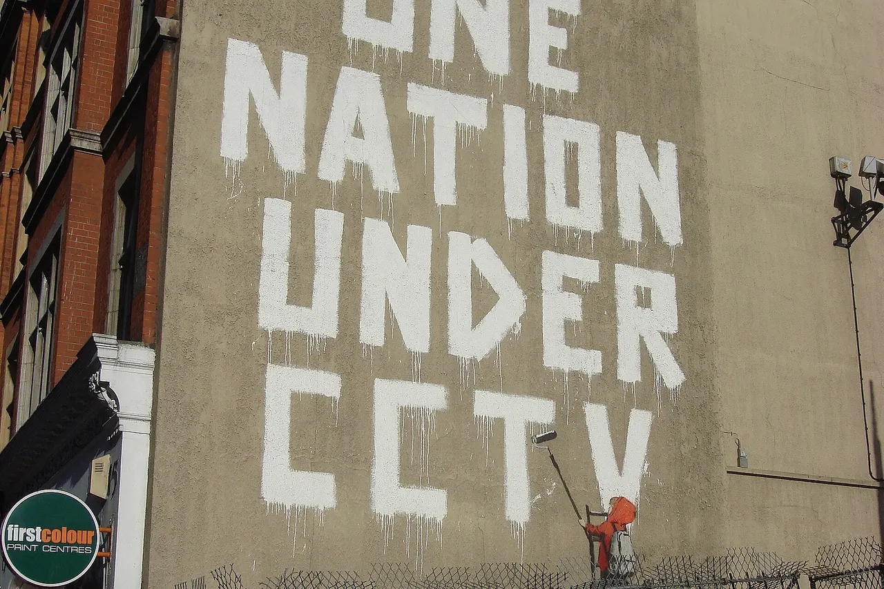 One nation under CCTV, Newman Street, London. By pseudo-anonymous, British graffiti artist Banksy