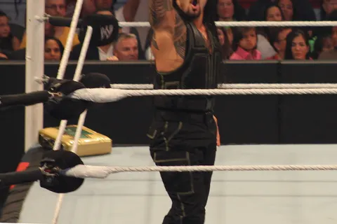 Roman Reigns calls for the Superman Punch.