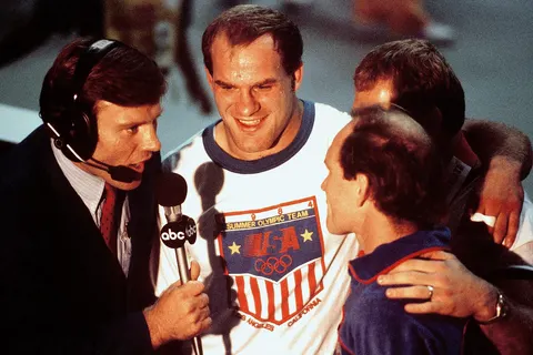 Ludwig Banach, second from left, is interviewed by an ABC television sports commentator after winning a gold medal in the 100 kg freestyle wrestling competition at the 1984 Summer Olympics.