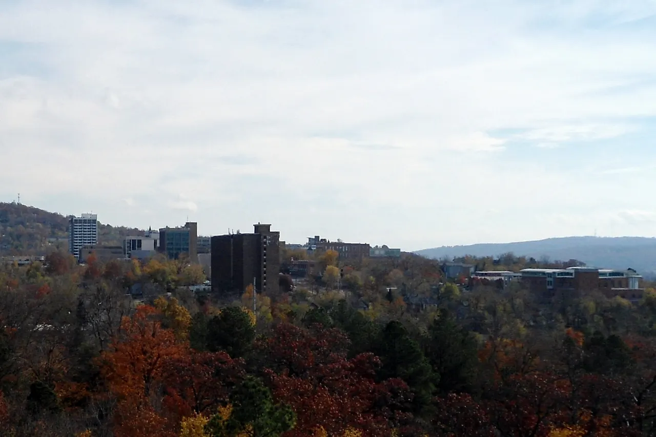 Landscape view of downtown Fayetteville, Arkansas. The photo features the Fayetteville Historic Square (center) and Fayetteville Public Library (right).