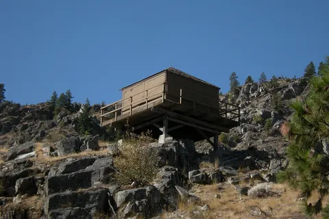 The cab of the Badger Mountain Lookout tower, Columbia Breaks Fire Interpretive Center (CBFIC), Washington. Badger Mountain Lookout is listed in the National Register of Historic Places; the structure was moved from East Wenatchee, Douglas County to the CBFIC to make it more accessible to the public. This is an image of a place or building that is listed on the National Register of Historic Places in the United States of America . Its reference number is 90001915 ( Wikidata ).