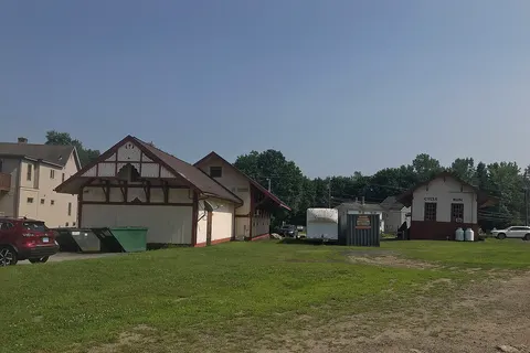 Facing south on the end of the former New Haven Railroad Colchester Branch. The passenger station on the left is now a package store and the freight house on the right is now a bike shop.