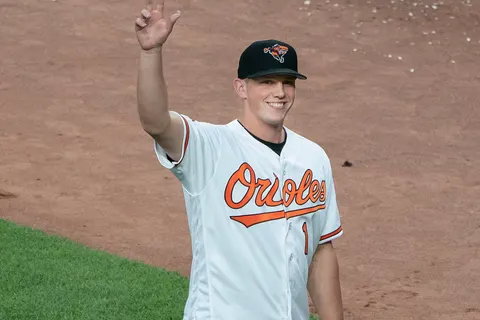 Adley Rutschman of the Baltimore Orioles acknowledges the crowd during a game at Oriole Park at Camden Yards on June 25, 2019 in Baltimore, Maryland.