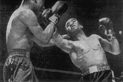 Bob Montgomery (left) blocks an uppercut from Beau Jack (right) during their match on May 21, 1943 at Madison Square Garden in New York City. Montgomery won the NYSAC Lightweight Title from Jack in a unanimous decision.