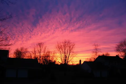 A photograph from Harleysville, Pennsylvania on 14 January 2005 of an amazing sunset . Photograph by Andrew Crouthamel .
