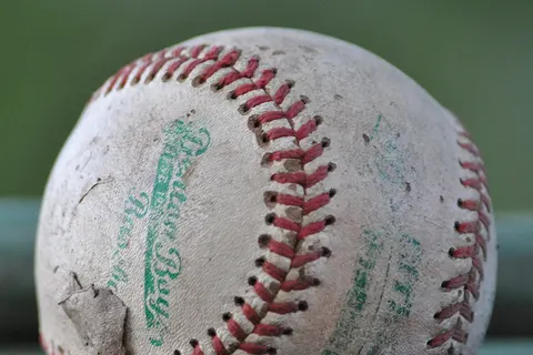 A baseball that has been extensively used