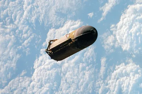 Shuttle external fuel tank jettisoned (NASA). Original description: The external fuel tank is jettisoned from the Space Shuttle Atlantis and falls toward Earth’s atmosphere during the completion of the launch phase of the STS-110 mission. Onboard were astronauts Michael J. Bloomfield, Stephen N. Frick, Jerry L. Ross, Ellen Ochoa, Steven L. Smith, Lee M. E. Morin, and Rex J. Walheim (8 April 2002).