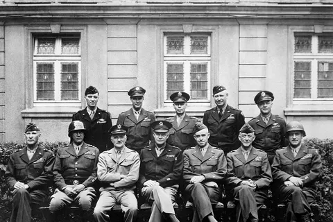 Senior American commanders of the European theater of World War II . Seated are (from left to right) Gens. William H. Simpson , George S. Patton , Carl A. Spaatz , Dwight D. Eisenhower , Omar Bradley , Courtney H. Hodges , and Leonard T. Gerow ; standing are (from left to right) Gens. Ralph F. Stearley , Hoyt Vandenberg , Walter Bedell Smith , Otto P. Weyland , and Richard E. Nugent .