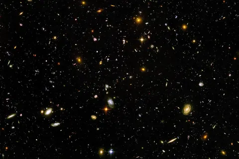 The Hubble Ultra Deep Field , is an image of a small region of space in the constellation Fornax, composited from Hubble Space Telescope data accumulated over a period from September 3, 2003 through January 16, 2004. The patch of sky in which the galaxies reside was chosen because it had a low density of bright stars in the near-field.
