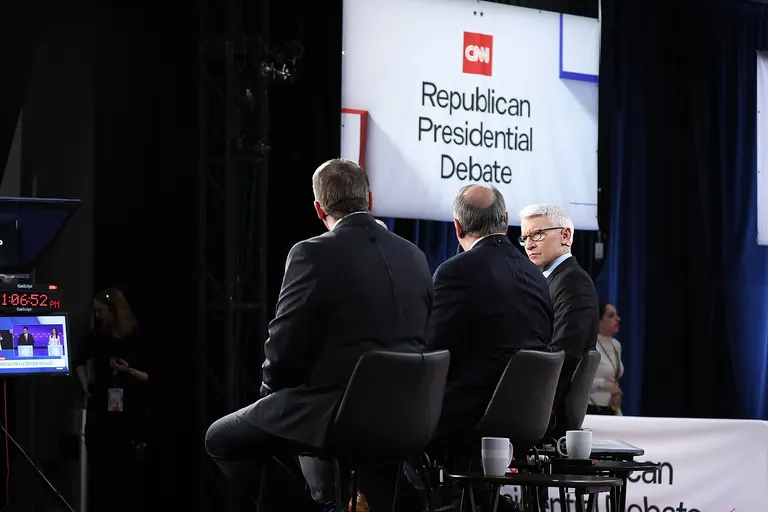 Scott Jennings, David Axelrod and Anderson Cooper speaking in the spin room following the CNN Republican Presidential Debate at the Olmsted Center at Drake University in Des Moines, Iowa. Please attribute to Gage Skidmore if used elsewhere.
