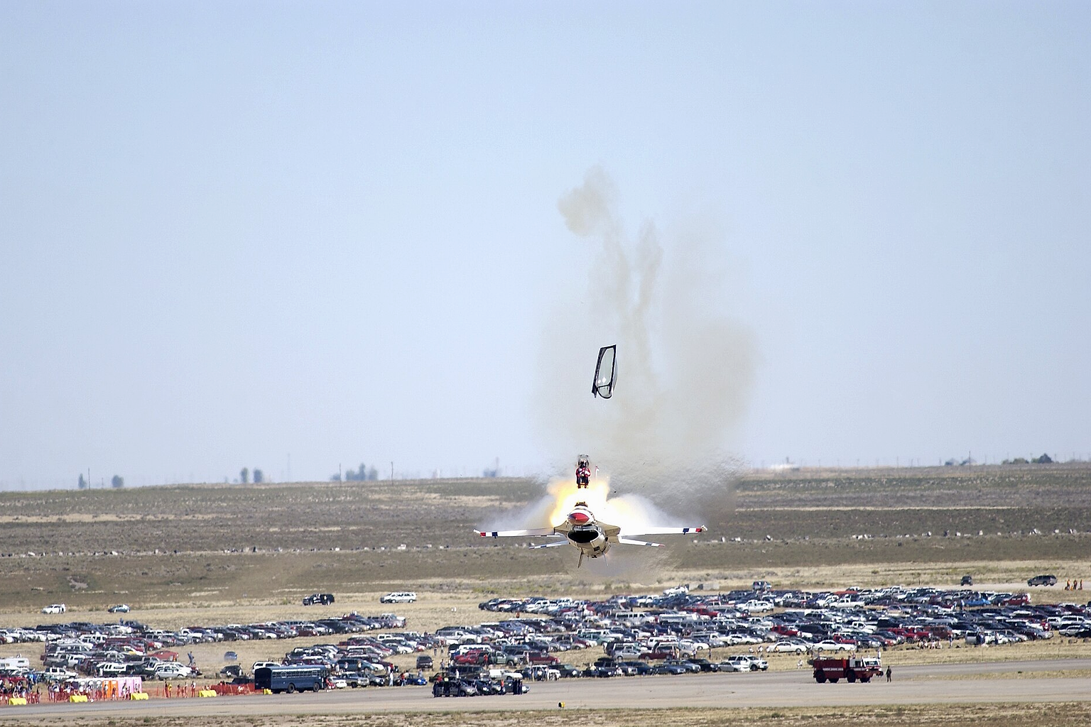 Mountain Home Air Force Base, Idaho — Capt. Christopher Stricklin ejects from the USAF Thunderbirds number six aircraft less than a second before it impacted the ground at an air show at Mountain Home Air Force Base, Idaho, Sept. 14. Stricklin, who was not injured, ejected after both guiding the jet away from the crowd of more than 60,000 people and ensuring he couldn't save the aircraft. This was only the second crash since the Air Force began using F-16 Falcons for its demonstration team in 1982. The ACES II ejection seat performed flawlessly. (U.S. Air Force photo by Staff Sgt. Bennie J. Davis III)