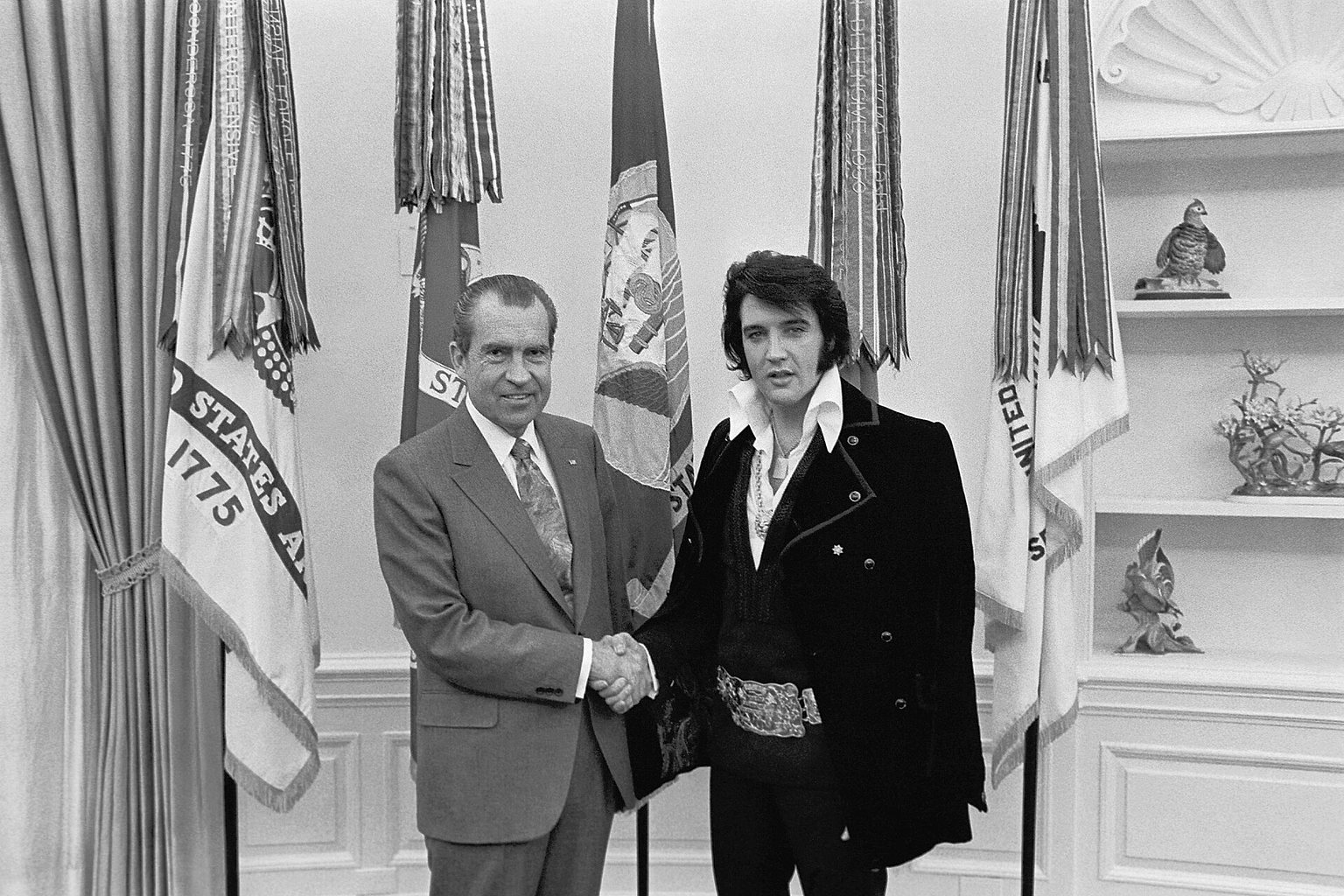 Elvis Presley meeting Richard Nixon . On December 21, 1970, at his own request, Presley met then-President Richard Nixon in the Oval Office of The White House . Elvis is on the right. Waggishly, this picture is said to be 'of the two greatest recording artists of the 20th century'. The Nixon Library & Birthplace sells a number of souvenir items with this photo and the caption, "The President & the King."