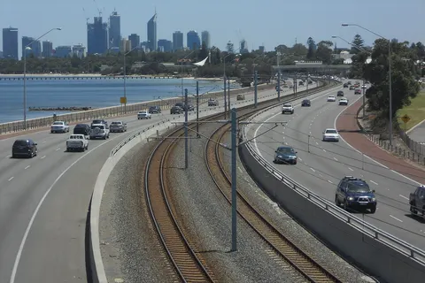 w:Kwinana Freeway , w:Mandurah railway , and w:Perth, Western Australia skyline from footbridge over freeway in w:Como, Western Australia