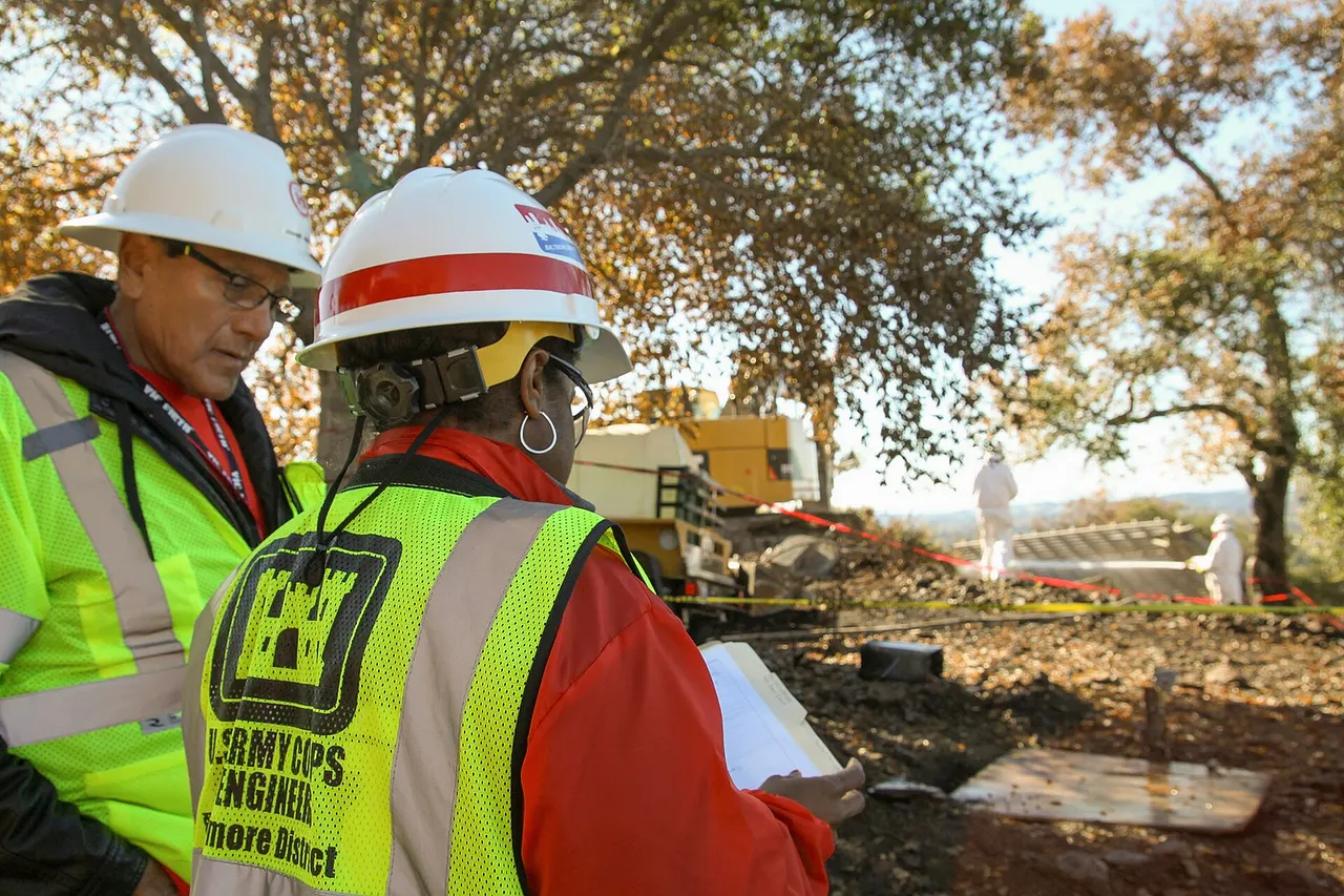 Joe Aguirre (left), a rehired annuitant and LaNesha Mincey, with the Baltimore District, U.S. Army Corps of Engineers, check on the progress of debris removal from a property damaged during the October wildfires in Napa, California on Nov. 17, 2017. (U.S. Army photo by Patrick Bloodgood/Released)