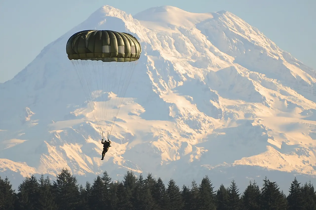 A Canadian special operations soldier descends in front of Mt. Rainier onto Fort Lewis, Wash., after jumping with U.S. 1st Special Forces Group Soldiers Dec. 2 during Menton week. The week-long celebration leads up to the 65th annual Menton Day, which commemorates the inactivation of the combined U.S. and Canadian First Special Service Force on Dec 5, 1944. See more at www.army.mil A special celebration: U.S., Canadian special forces commemorate combined efforts during WWII