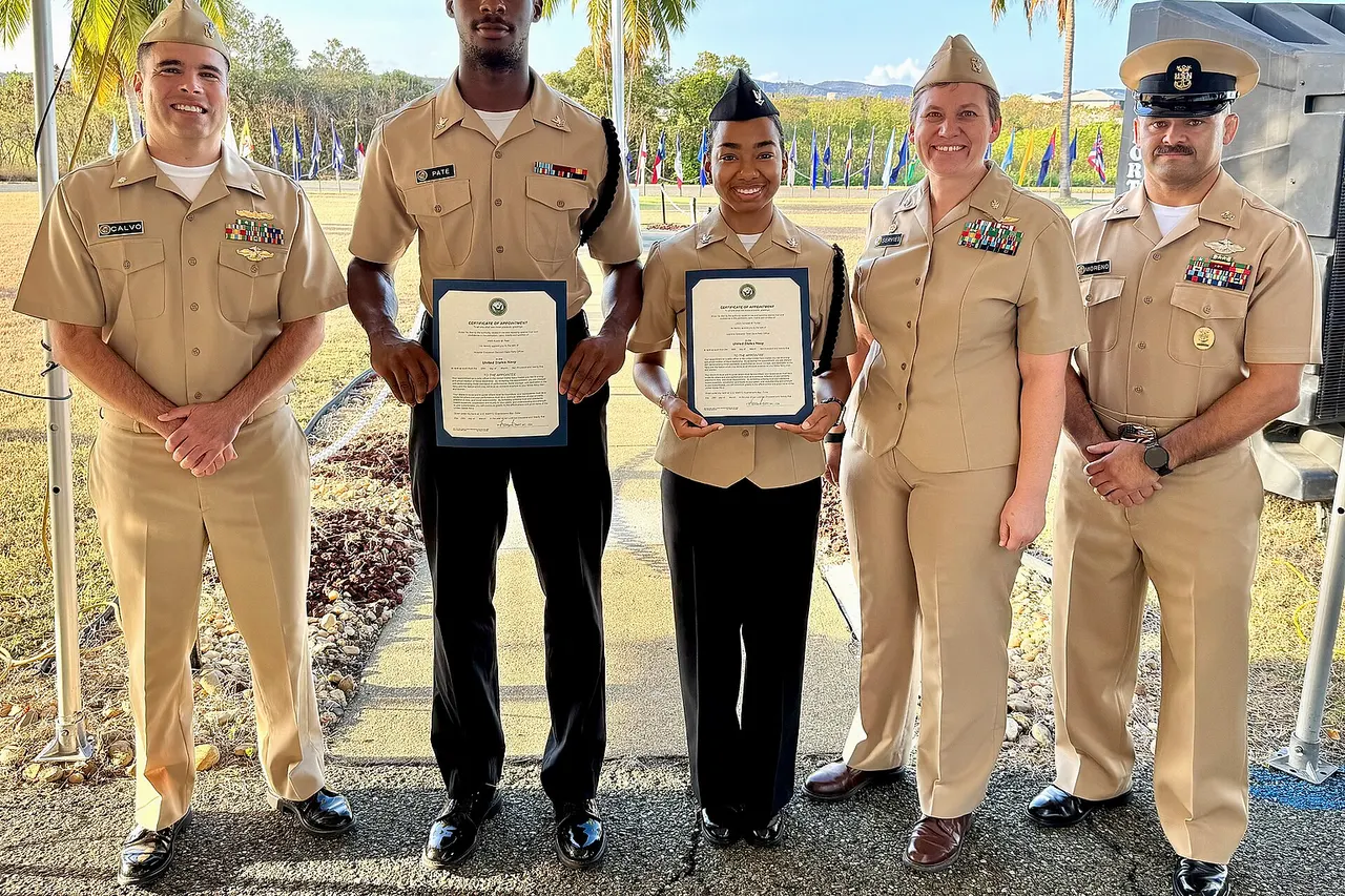 GUANTANAMO BAY, Cuba –Hospital Corpsman 2nd Class Austin Pate and Hospital Corpsman 3rd Class Damelah Fluker display their certificates of appointment after being promoted in rank by Capt. Tammy Servies, director of U.S. Naval Hospital Guantanamo Bay and commanding officer of U.S. Navy Medicine Readiness and Training Command, Guantanamo Bay, Mar. 28, 2025. Also pictured, Cmdr. Angel Calvo, acting executive officer, and Command Master Chief Francisco Moreno. The Meritorious Advancement Program allows commanding officers to recognize their best Sailors by advancing them when they are ready for the next level of responsibility. (U.S. Navy photo by Emily McCamy/released)