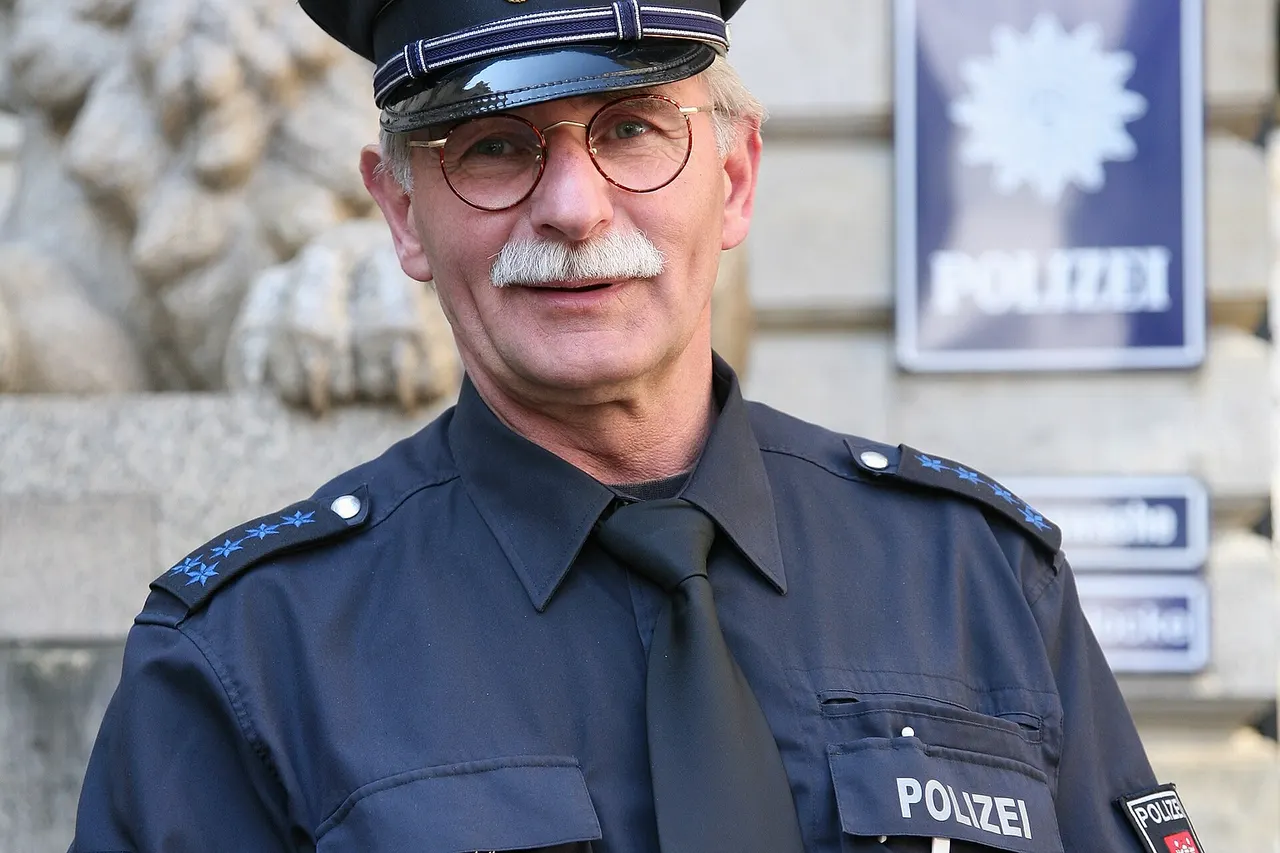 A senior police officer of the Hamburg police on assignment at Hamburg city hall, Germany.