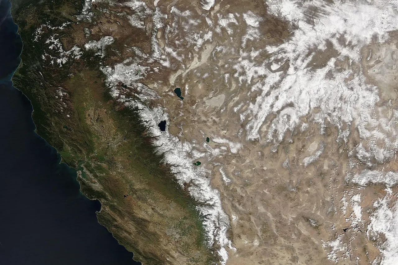 Snow topped high elevations in the Southwestern United States in mid-March 2022 after a series of winter storms added to a generally light winter snowpack. The Moderate Resolution Imaging Spectroradiometer (MODIS) on board NASA’s Aqua satellite acquired a true-color image of the scene on March 11. California’s Sierra Nevada Mountains appear to be blanketed with a heavy layer of snow, especially in the south. All of the high mountain ranges across Nevada are also snow-covered. Lake in the region, including Lake Tahoe on the border between California and Nevada and Pyramid Lake which sits to the north, remain ice-free. Despite heavy snows in December 2021, snowpack in most of the Sierra Nevada Mountains is likely to end the season below average. According to a report by CNN on March 2, the manager of the Snow Surveys and Water Supply Forecasting Program, part of the California Deportment of Water Resources, the latest statewide snow melt forecast came it at only about 66 percent of average. Because the state’s water supply is heavily dependent on winter snowpack in the Sierra Nevada, it is unlikely to fill the reservoirs. Fortunately, storms have rolled across the region between March 2 and March 10. The Sierra Avalanche Center reported that up to 6 inches of new snow had fallen in parts of the mountains from March 3-5. An additional 2 inches of new snow was added on March 10.