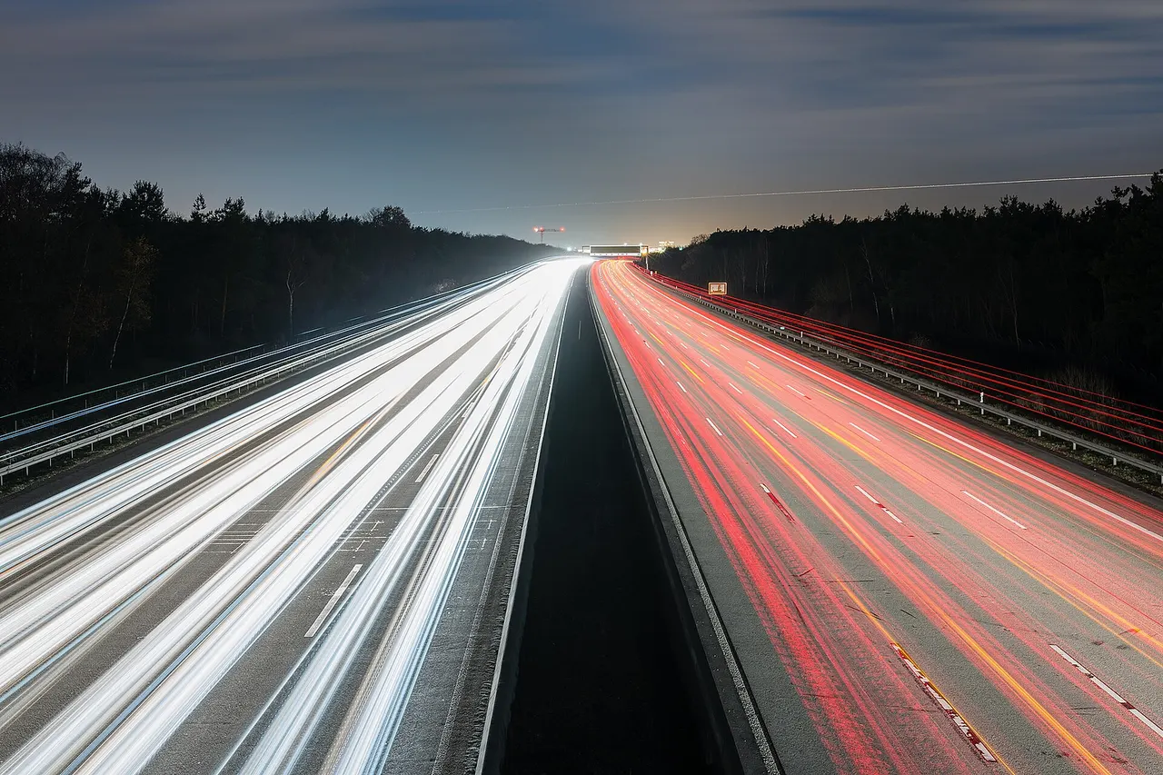 Highway A5 at the south of Frankfurt/Main with Frankfurt airport on the horizon, Hesse, Germany.